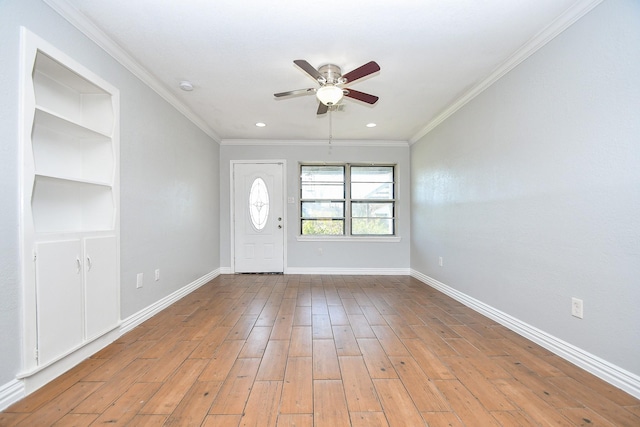 entryway featuring light wood finished floors, baseboards, and ornamental molding