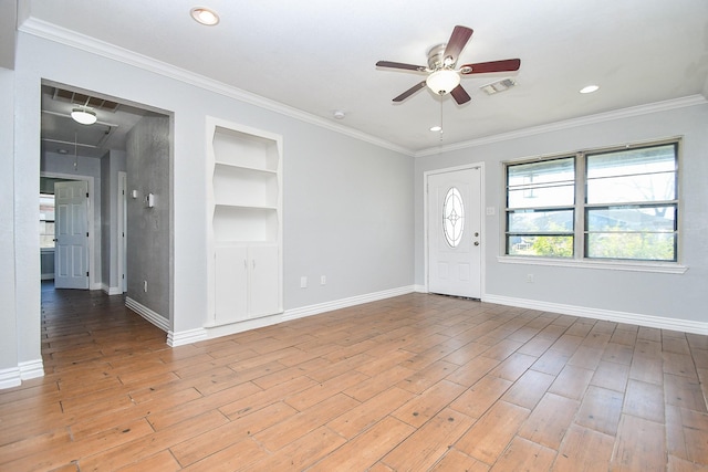 entrance foyer featuring a ceiling fan, light wood-style floors, baseboards, and ornamental molding