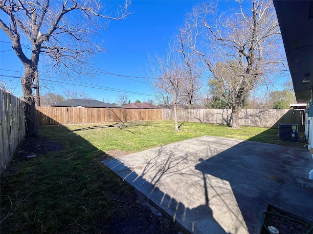 view of yard with cooling unit, a fenced backyard, and a patio area