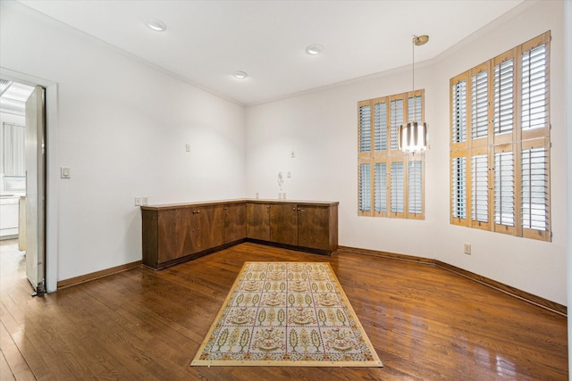 unfurnished room with recessed lighting, wood finished floors, and baseboards