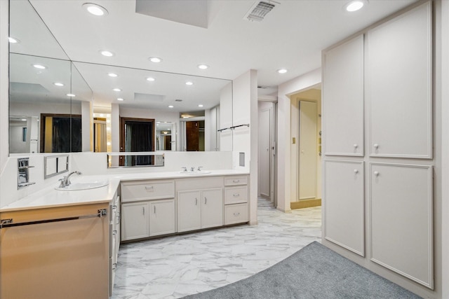 full bath featuring marble finish floor, visible vents, a sink, and recessed lighting