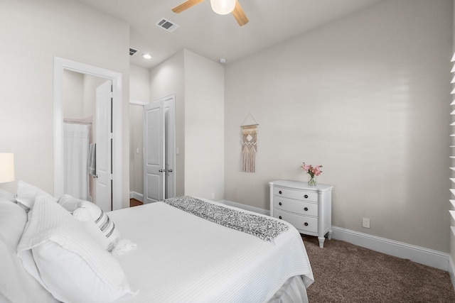 bedroom featuring a ceiling fan, visible vents, baseboards, ensuite bath, and carpet flooring