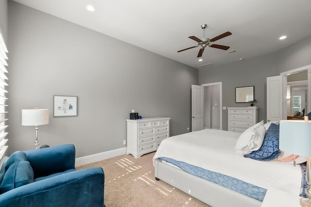 bedroom featuring visible vents, recessed lighting, baseboards, light colored carpet, and ceiling fan