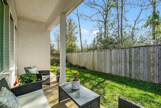 exterior space with outdoor lounge area and a fenced backyard