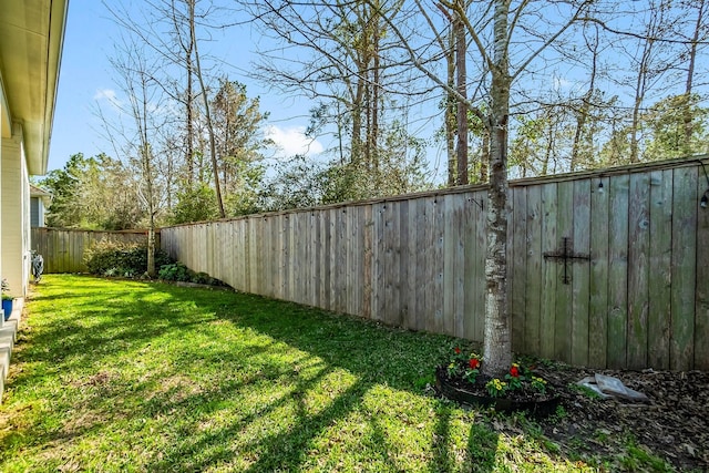 view of yard with a fenced backyard