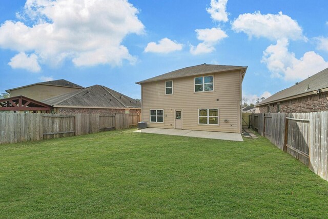 back of house featuring a patio area, a fenced backyard, cooling unit, and a lawn