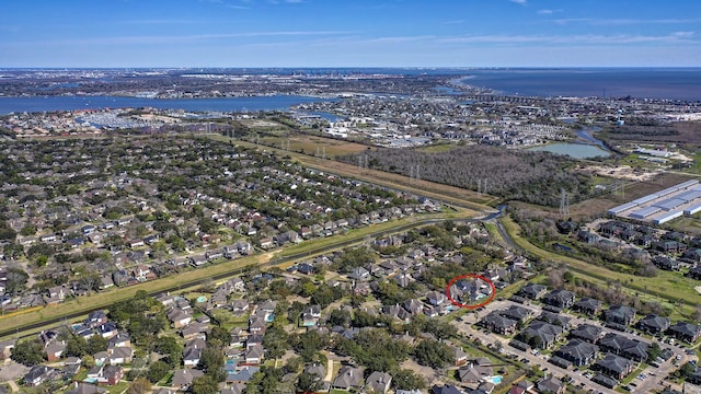 drone / aerial view featuring a water view and a residential view