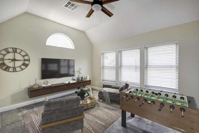 playroom with visible vents, vaulted ceiling, carpet flooring, and ceiling fan