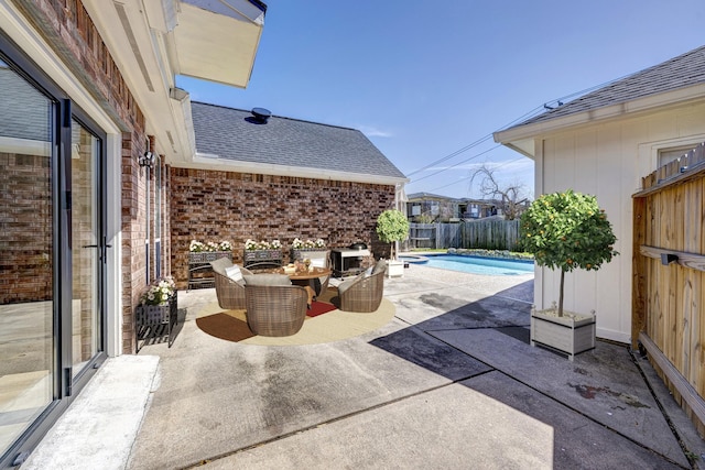 view of patio / terrace featuring fence and a fenced in pool