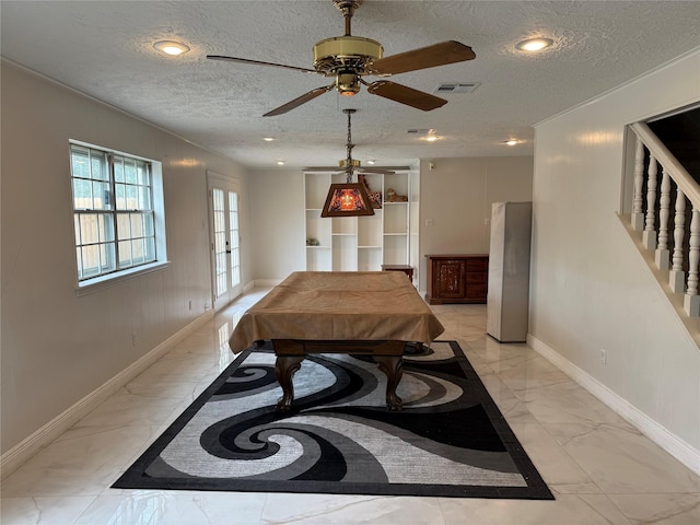 recreation room featuring marble finish floor, recessed lighting, visible vents, a textured ceiling, and baseboards