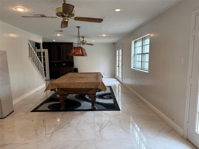 dining area with marble finish floor, visible vents, stairway, and a textured ceiling