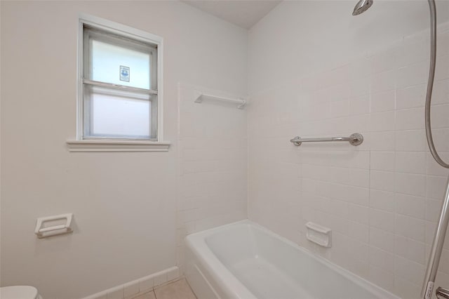 full bath featuring  shower combination, tile patterned flooring, baseboards, and toilet