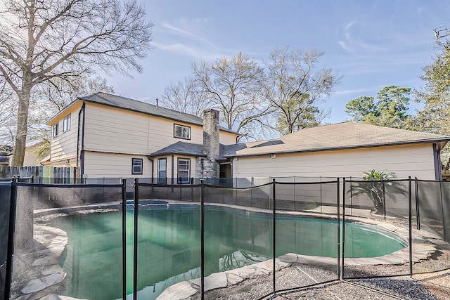 view of swimming pool featuring a fenced backyard and a fenced in pool