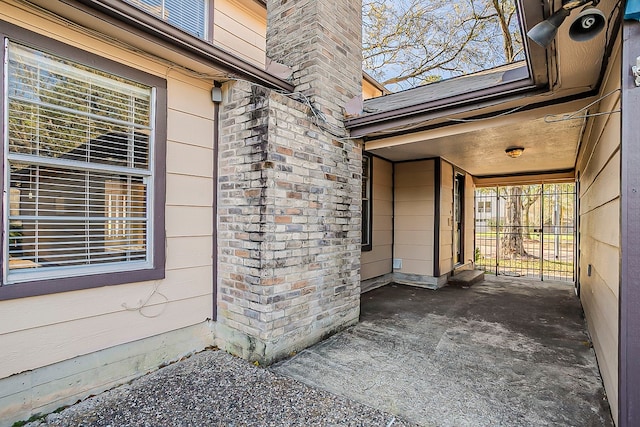 doorway to property with a chimney