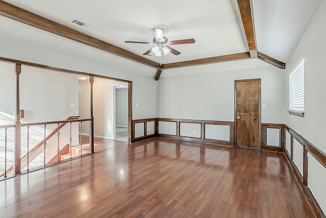 unfurnished room featuring vaulted ceiling with beams, visible vents, ceiling fan, and wood finished floors