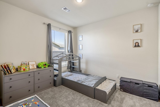 bedroom featuring visible vents and carpet flooring