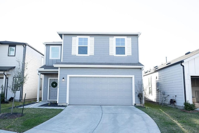 traditional-style home featuring concrete driveway, board and batten siding, an attached garage, and a front yard