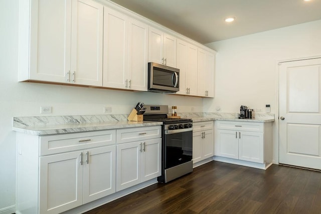 kitchen featuring appliances with stainless steel finishes, recessed lighting, white cabinets, and dark wood finished floors