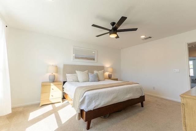 bedroom featuring light carpet, visible vents, and baseboards