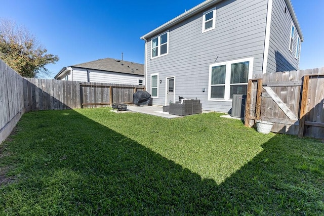 rear view of property with a lawn, a fenced backyard, cooling unit, a patio area, and outdoor lounge area