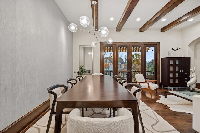 dining space featuring beam ceiling, wood finished floors, recessed lighting, french doors, and arched walkways