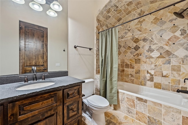 full bathroom featuring toilet, vanity, and tiled shower / bath combo