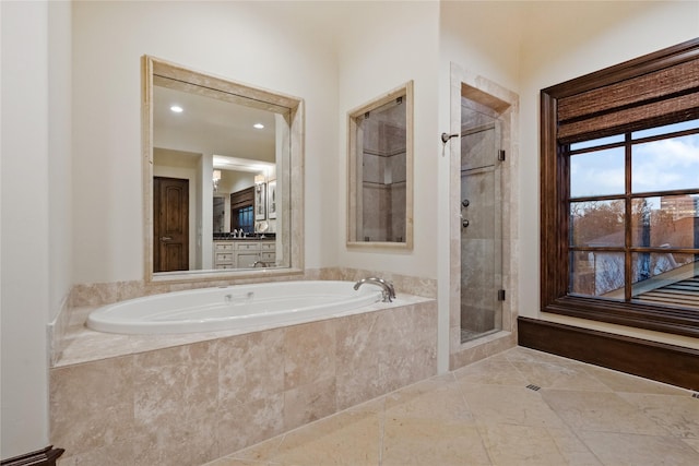 full bath with a garden tub and a shower stall