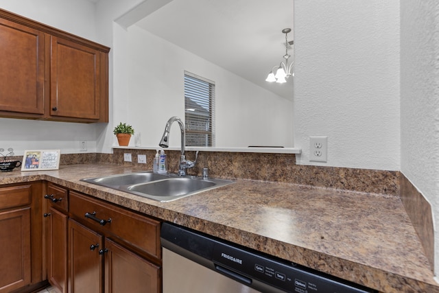 kitchen with decorative light fixtures, dark countertops, an inviting chandelier, a sink, and dishwasher