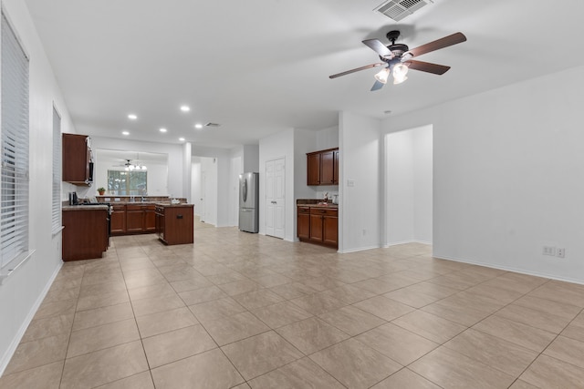 interior space with recessed lighting, visible vents, ceiling fan, and light tile patterned flooring