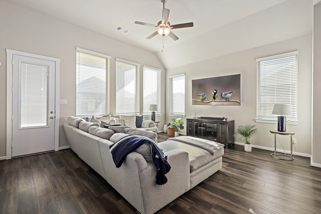 living area featuring baseboards, visible vents, dark wood finished floors, a ceiling fan, and vaulted ceiling