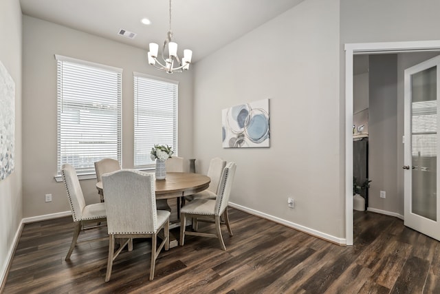 dining room featuring visible vents, baseboards, a chandelier, and dark wood-type flooring