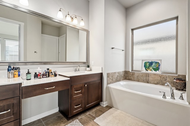 full bathroom featuring double vanity, a sink, and a bath