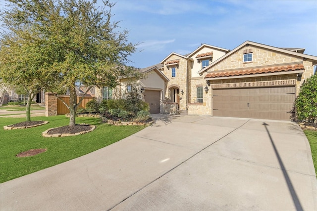 view of front of property with stone siding, concrete driveway, a front yard, and a garage