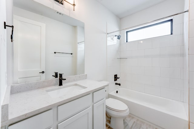 full bath with shower / bathtub combination, visible vents, vanity, and toilet