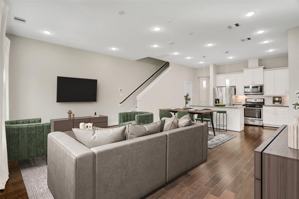 2434 Cochran St, Houston, TX 77009 - living room with dark wood-type flooring and visible vents