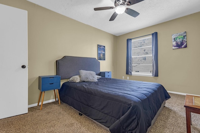 carpeted bedroom featuring a textured ceiling, ceiling fan, and baseboards