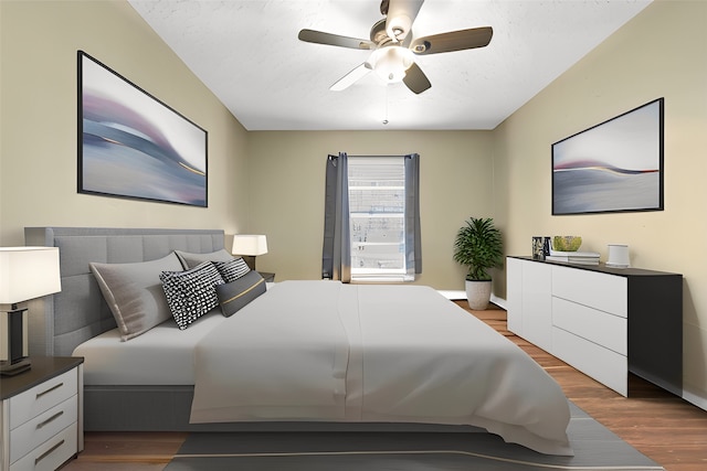 bedroom featuring a ceiling fan and wood finished floors