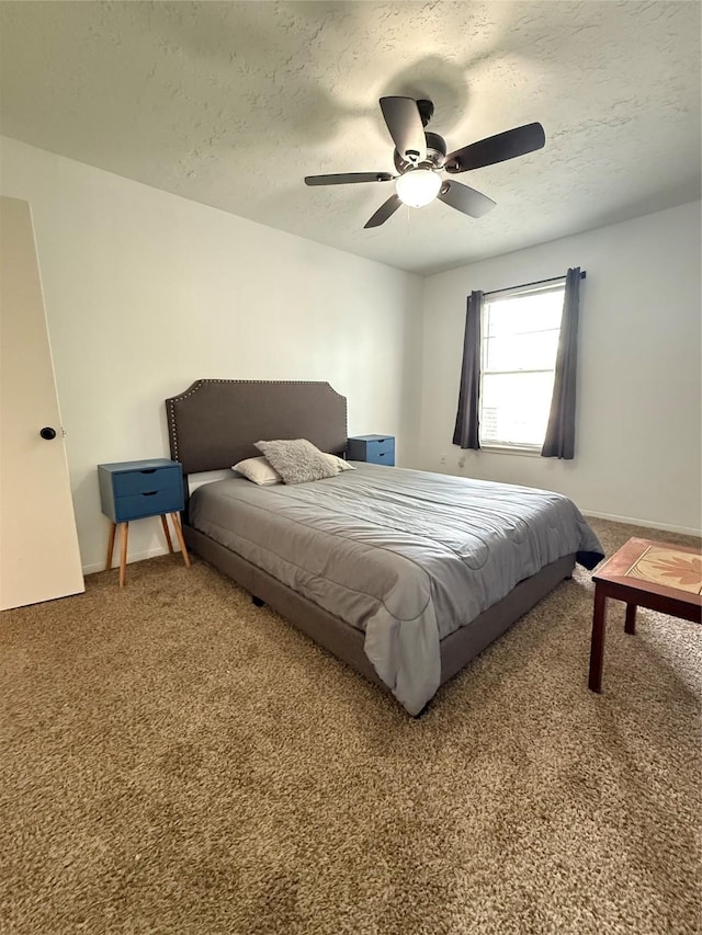 15523 Canterbury Forest Dr, Tomball, TX 77377 - carpeted bedroom featuring a textured ceiling and ceiling fan