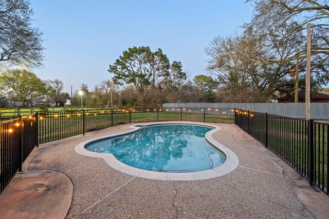 view of pool featuring a fenced backyard and a fenced in pool