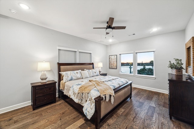 bedroom featuring recessed lighting, visible vents, baseboards, and dark wood-type flooring