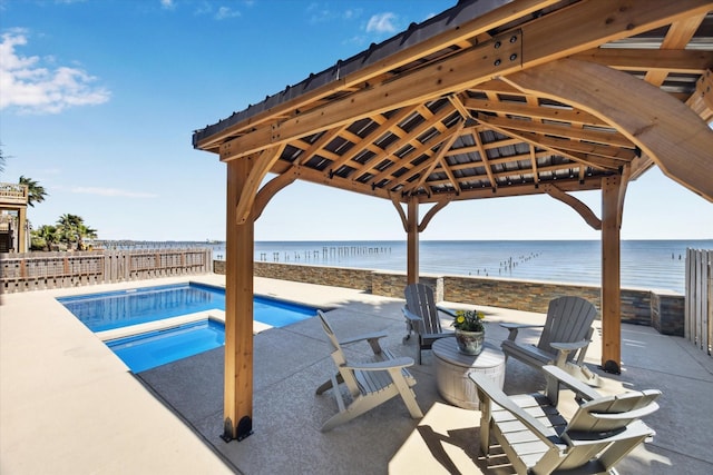 view of pool featuring a fenced in pool, a patio, fence, and a water view