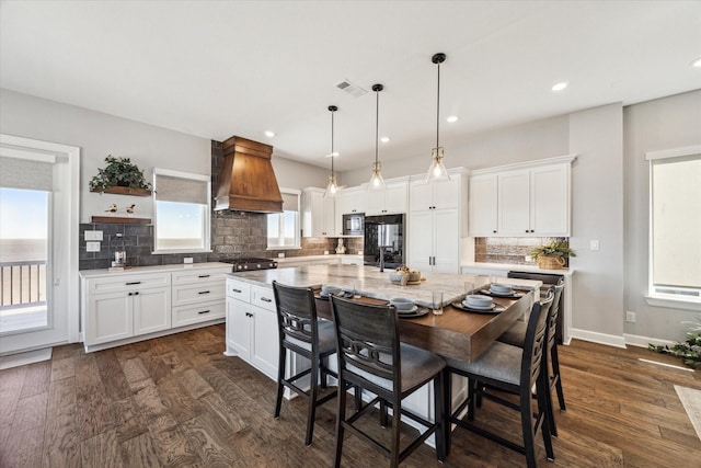 kitchen featuring dark wood finished floors, white cabinets, custom range hood, and open shelves