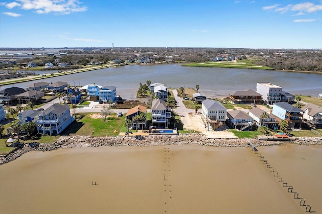 drone / aerial view with a residential view and a water view