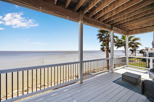 wooden deck with a water view