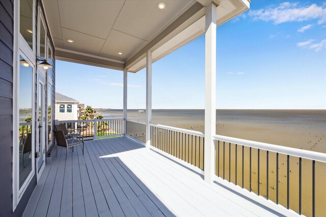 wooden deck featuring a water view