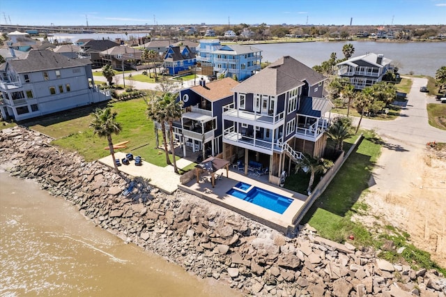 birds eye view of property featuring a residential view and a water view