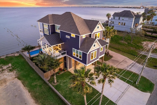 birds eye view of property featuring a water view