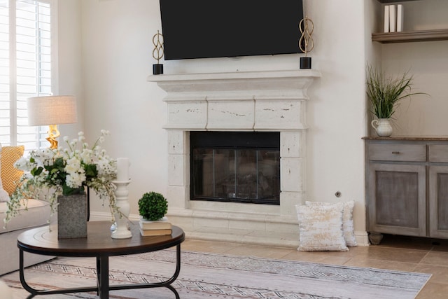 tiled living room with a tiled fireplace