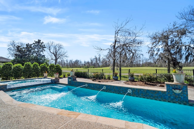 view of pool featuring a fenced in pool, a rural view, fence, and an in ground hot tub