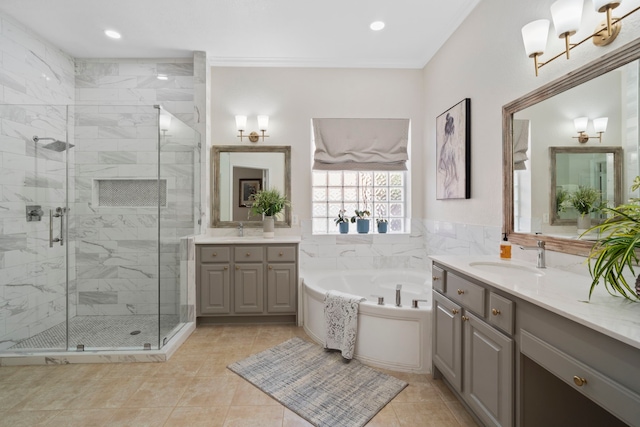 full bath with a bath, a shower stall, ornamental molding, and a sink